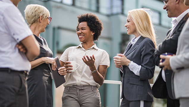 A group of employees laughing outside