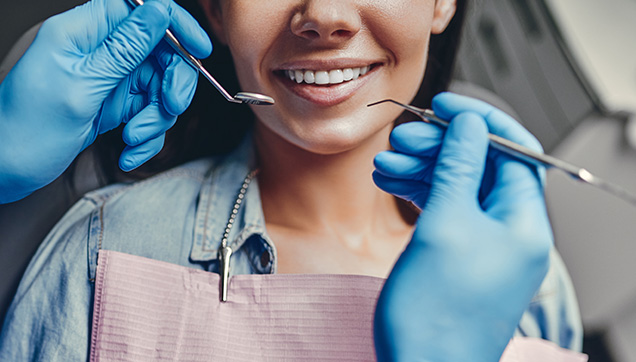 A dentist conducting an exam on a patient