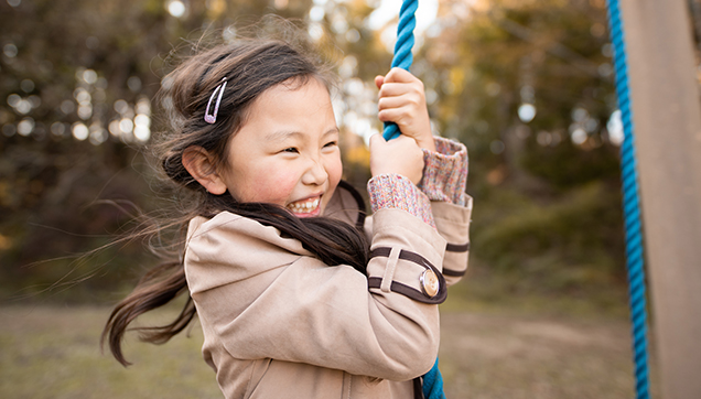 A child swinging at a playground