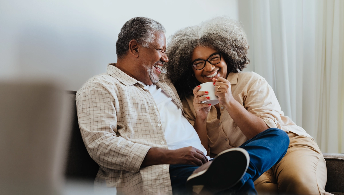older-couple-laughing-together-1200x683.webp