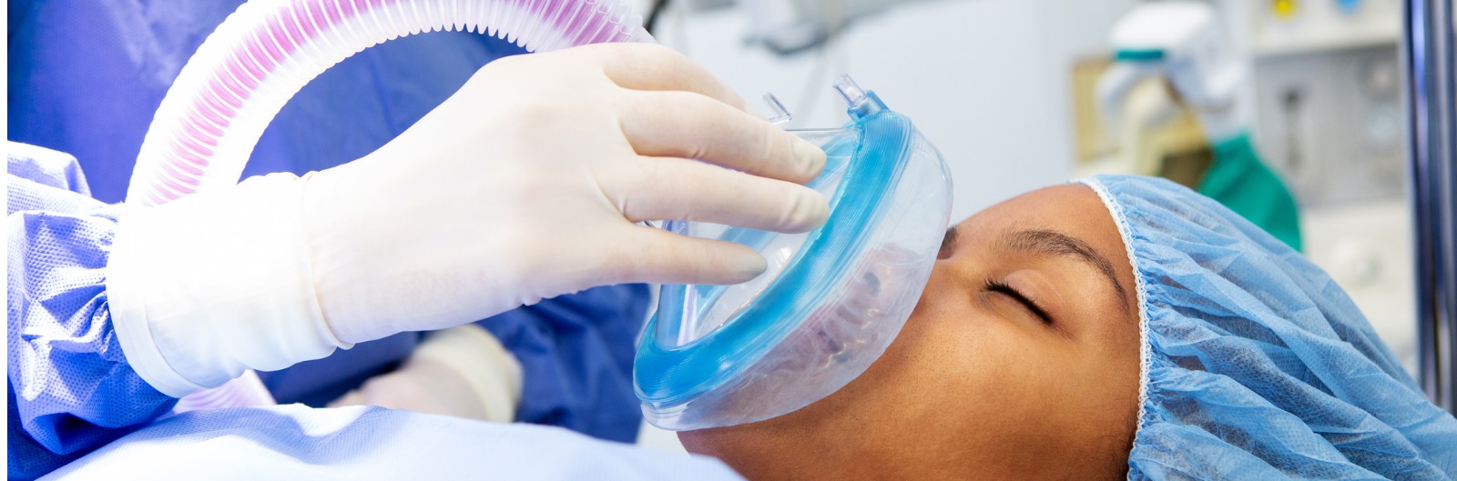 A patient receiving analgesia from a mask