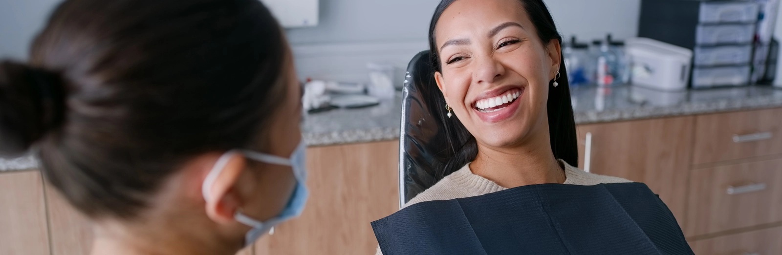 woman-smiling-in-dental-chair_1600x522.webp