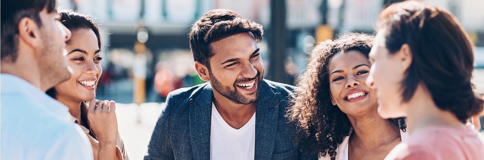 A group talking and laughing outside