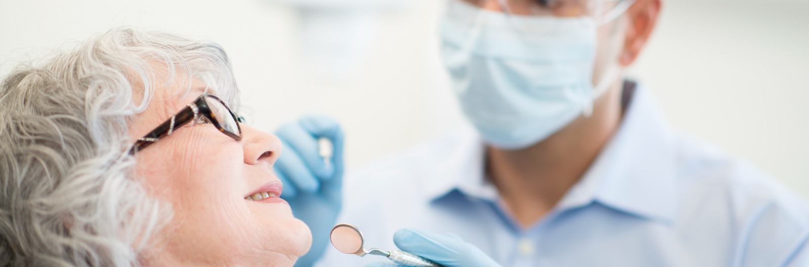 A dentist conducting an exam on a patient