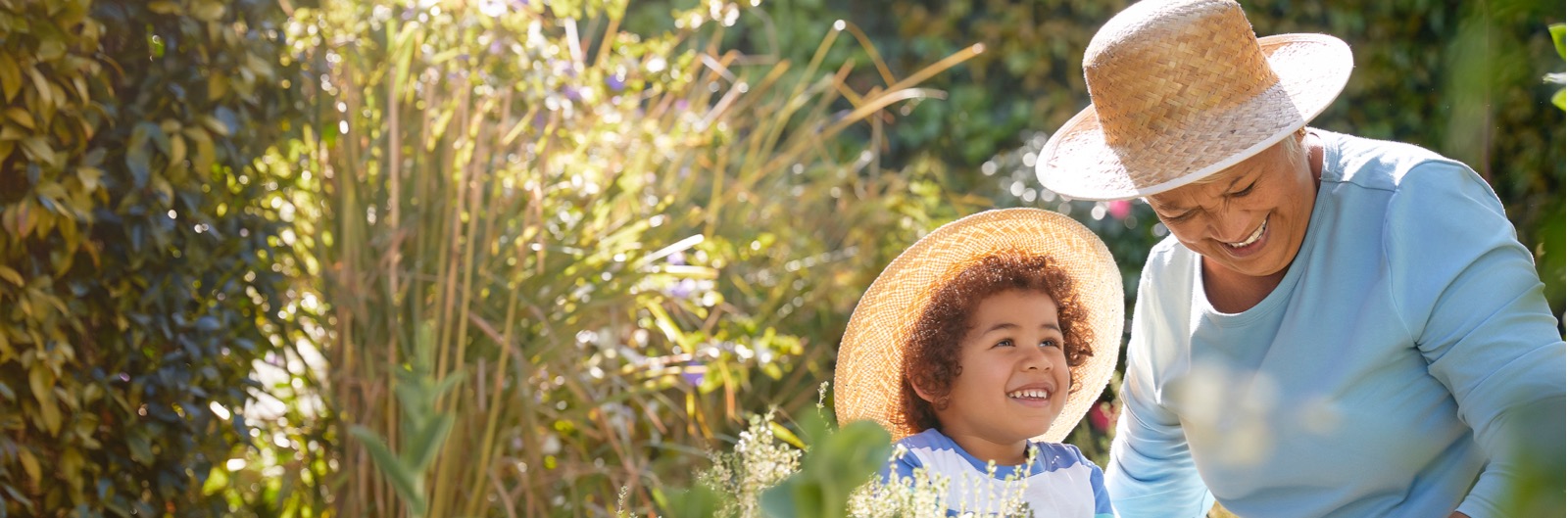 A grandmother and grandchild gardening