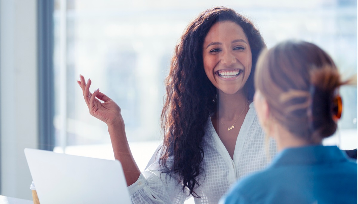 Two employees laughing