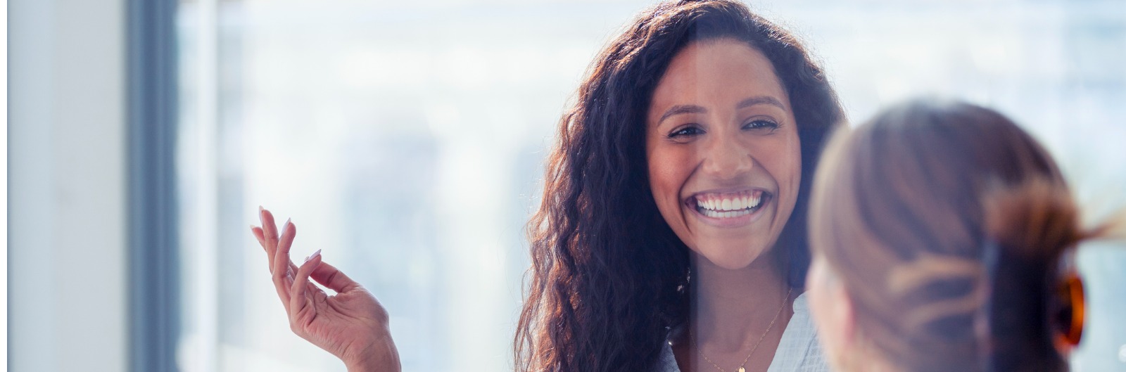 Two employees laughing