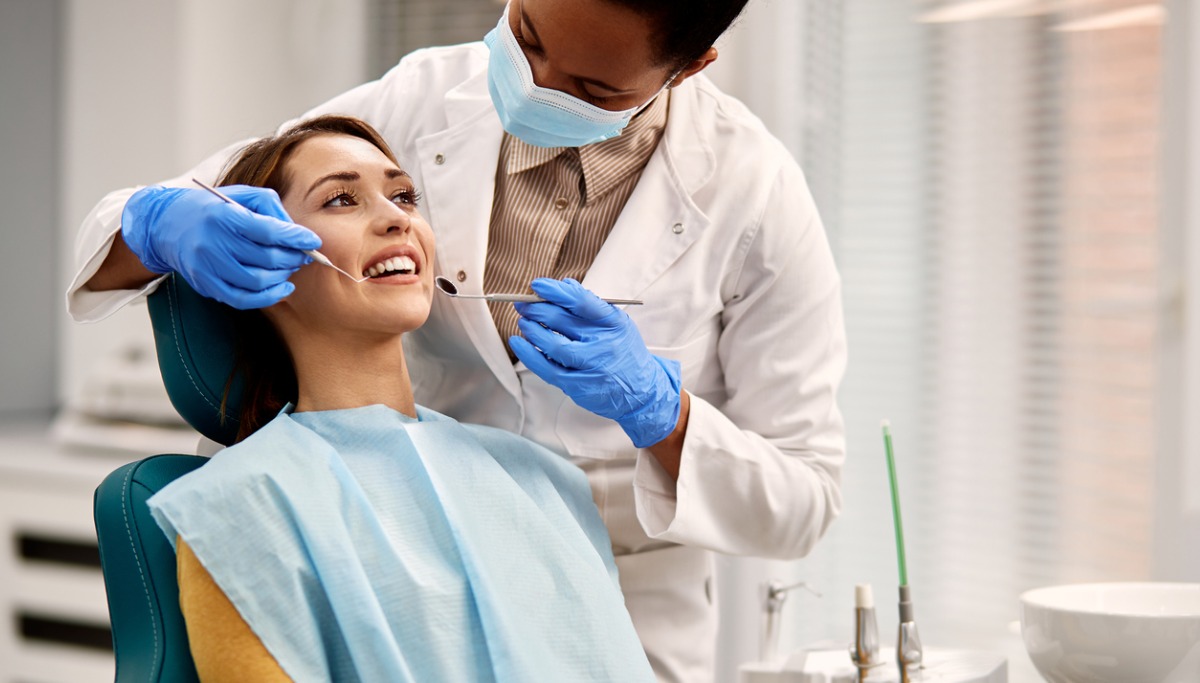 A dentist conducting an exam on a patient