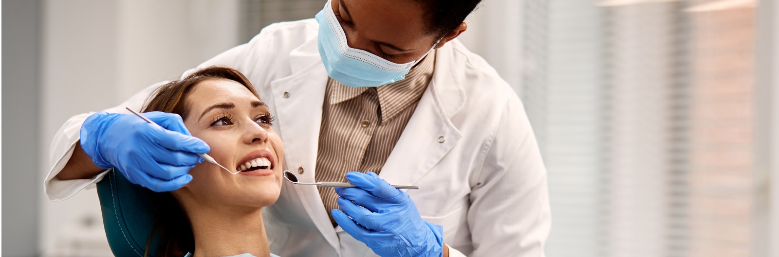 A dentist conducting an exam on a patient