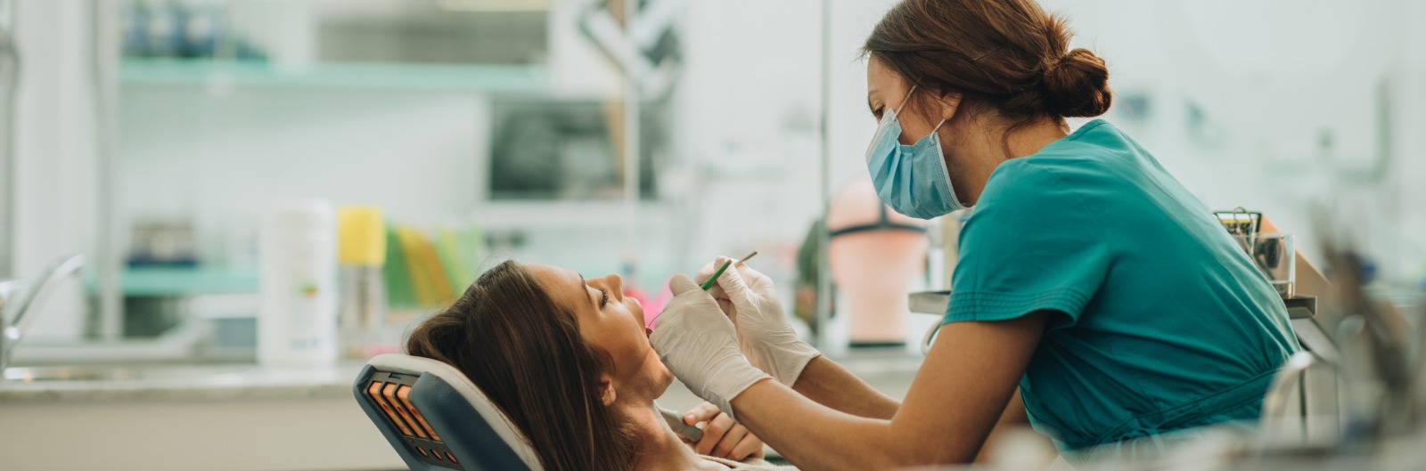 A dentist conducting an exam on a patient