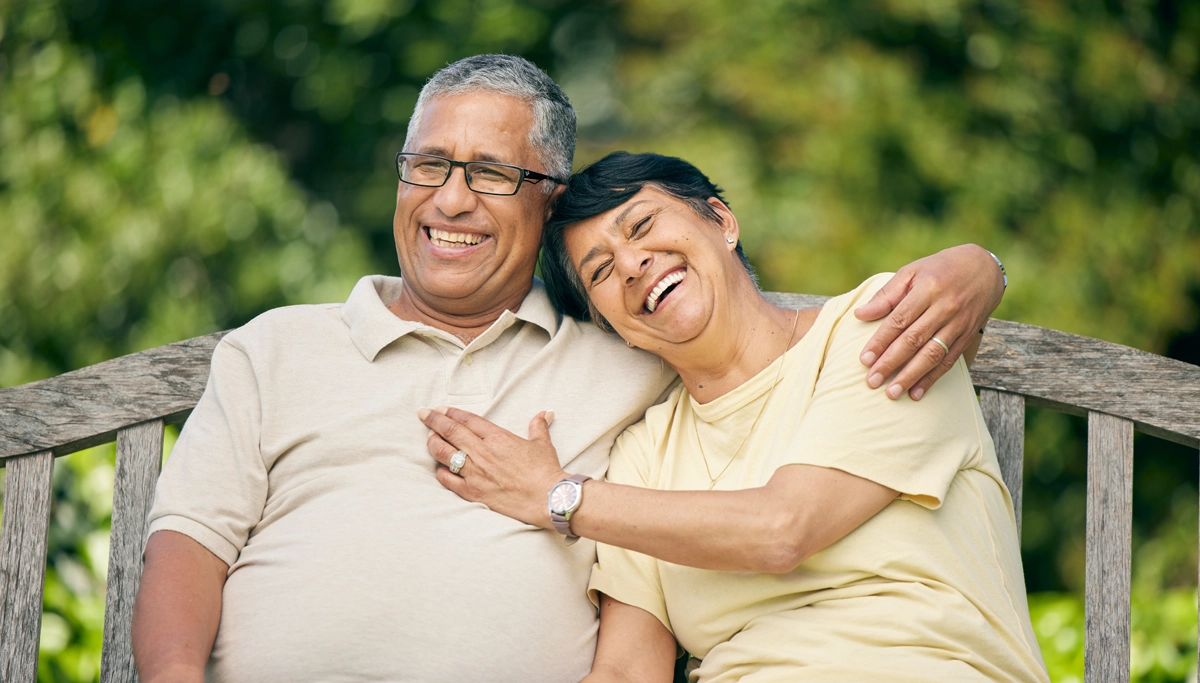 older-couple-laughing-outside-1200x683.webp