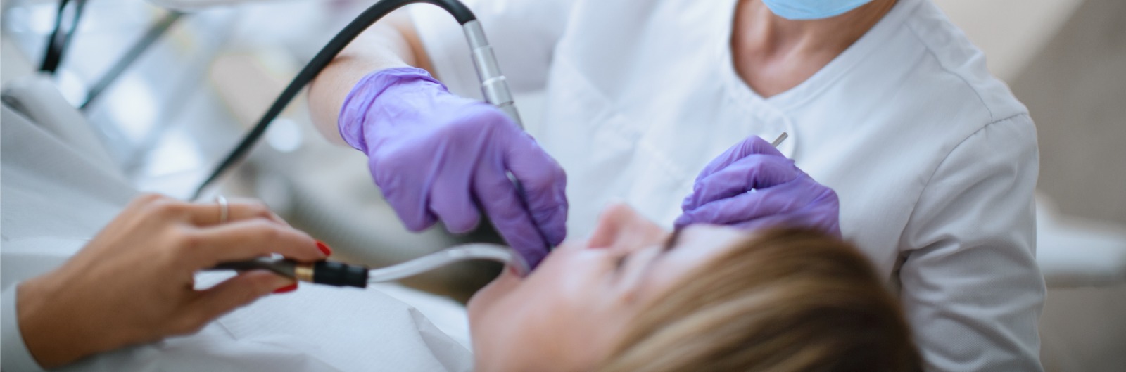 A dentist conducting a tooth filling