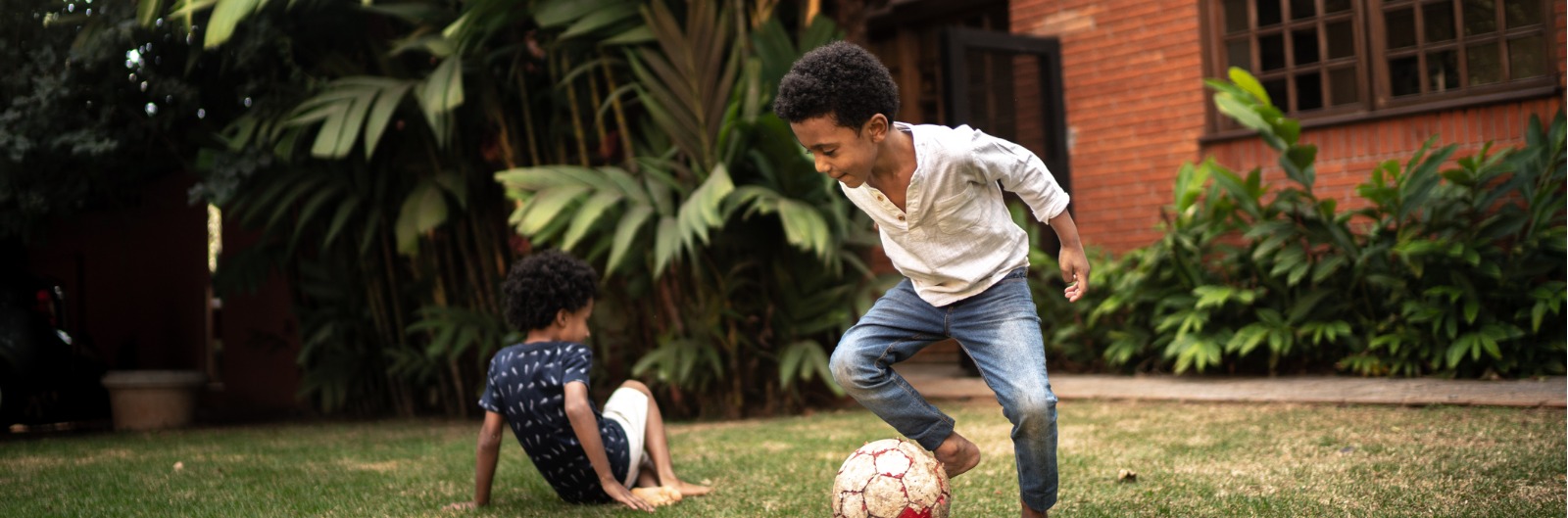 Two kids playing soccer