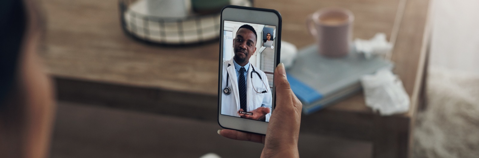 A patient having a video call with their dentist