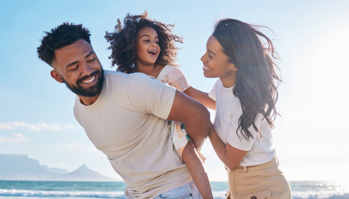 A family playing at the beach