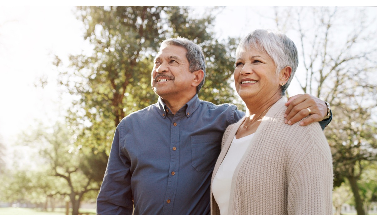 A husband with his arm around his wife