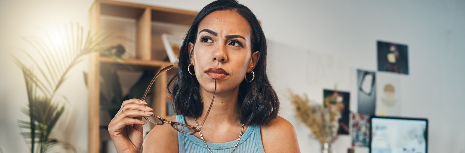 A woman thinking about the cost of a wisdom tooth removal